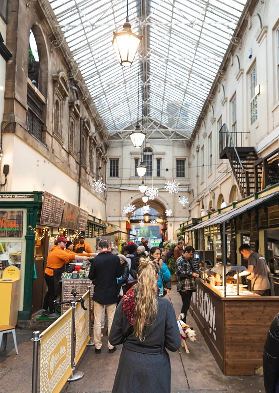 View of Bristol's skyline with historic buildings and vibrant street life.