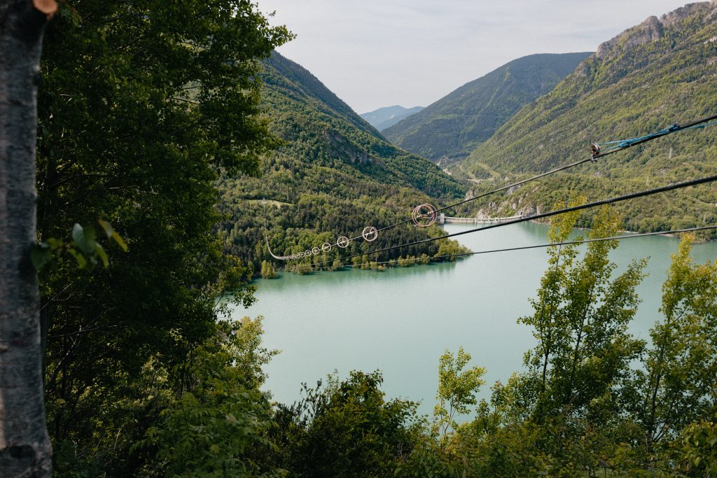 Adventurers enjoying the thrilling zipline in Valle de Tena, a top experience and place to visit in Huesca.
