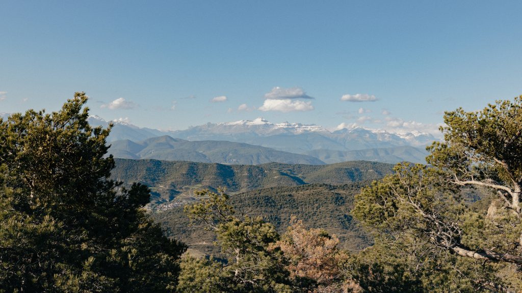 A group of e-bikers on scenic trails in Boltaña, with views of lush forests and mountain vistas. 7-day itinerary exploring Huesca’s adventure destinations