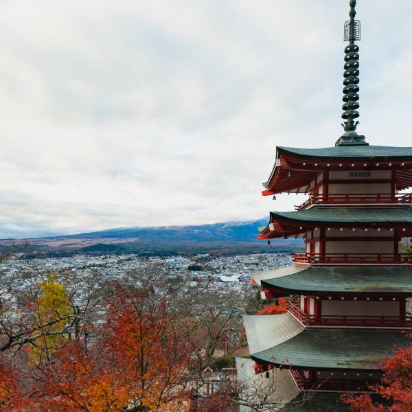 Golden foliage framing Chureito Pagoda and Mount Fuji, a quintessential autumn in Japan scene.
