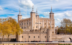 The historic Tower of London with the River Thames in the foreground.