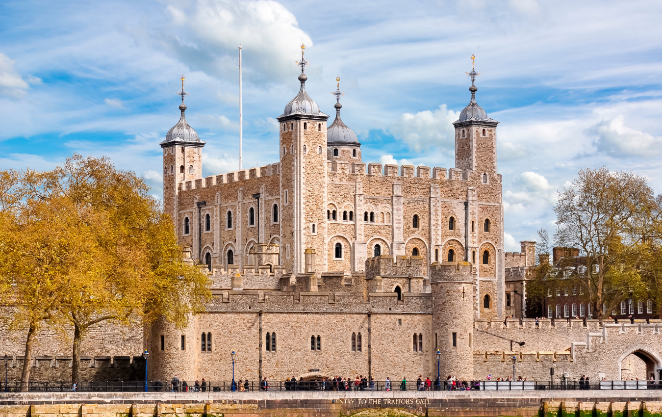 The historic Tower of London with the River Thames in the foreground.