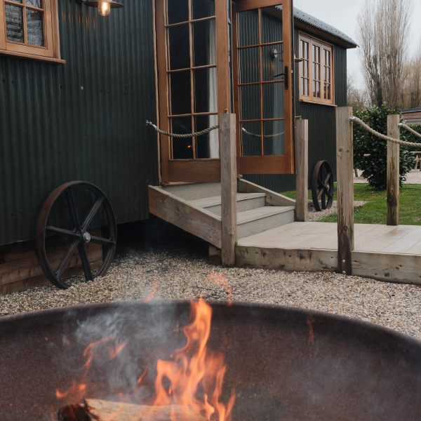 Deck by the river outside the Tewinbury Lake Huts
