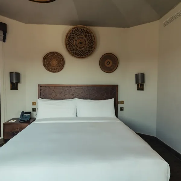 Bedroom inside a luxury tent at Al Badayer Retreat