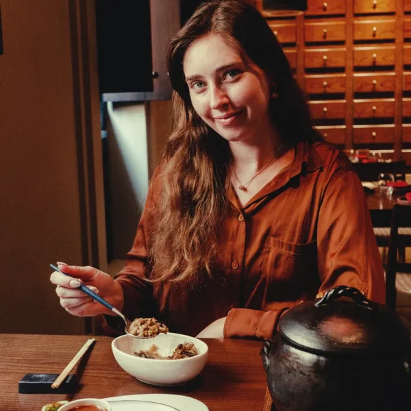 Helena smiling over lunch at Nomani restaurant, The Chedi Al Bait
