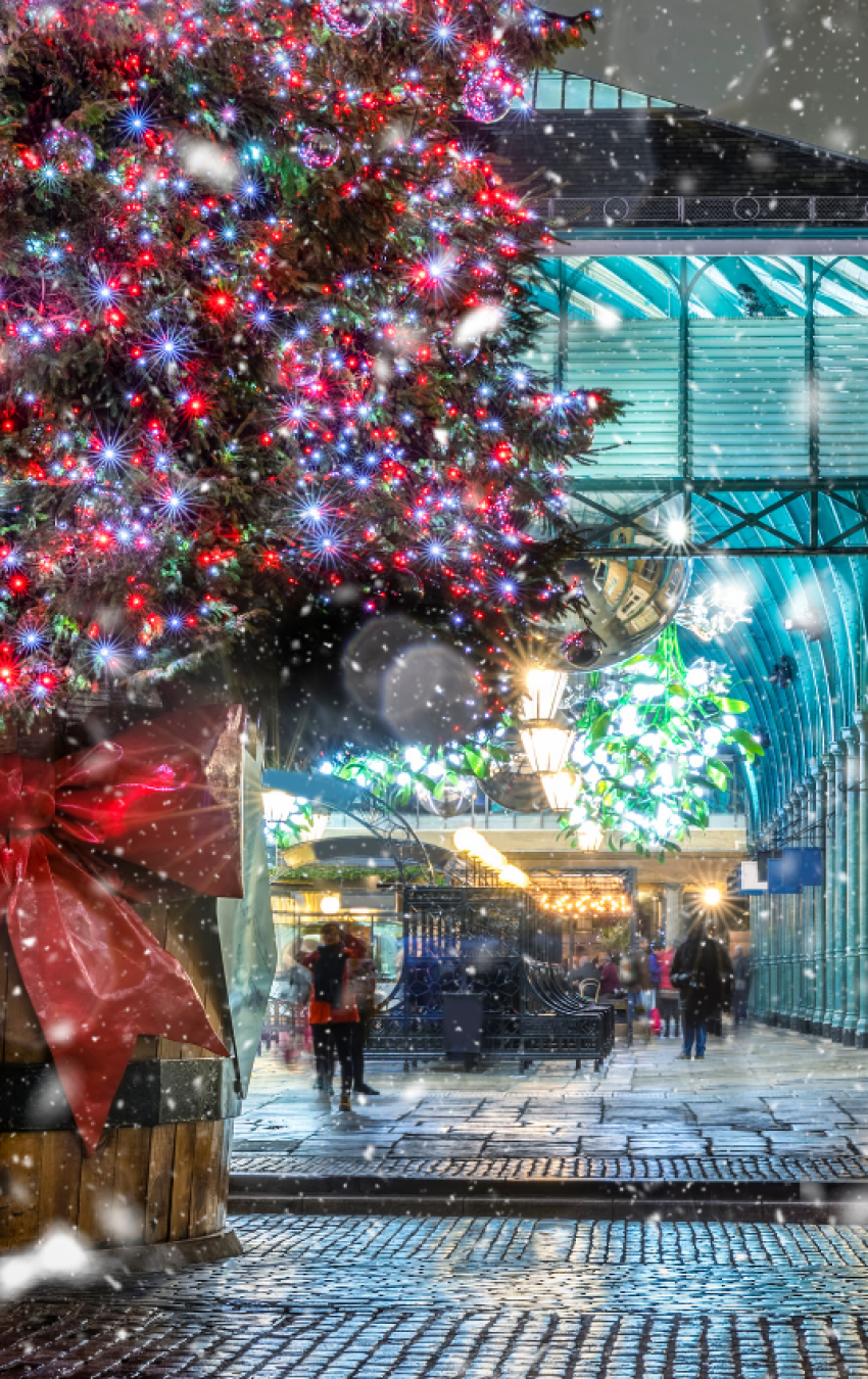 Covent Garden Christmas tree with festive lights and red sleigh in London 2024